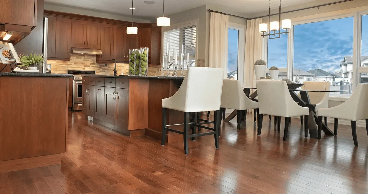 A modern kitchen with professionally installed wood flooring in Evansville, IN