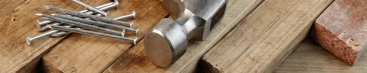 Hammer and nails on hardwood flooring boards in Evansville, IN