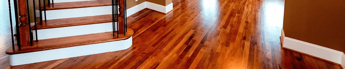 Base floor of a staircase with professionally restored wood flooring in Evansville IN
