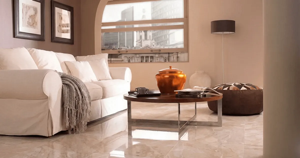 Modern living room with professionally installed marble flooring, a beige sofa, coffee table in Evansville, IN
